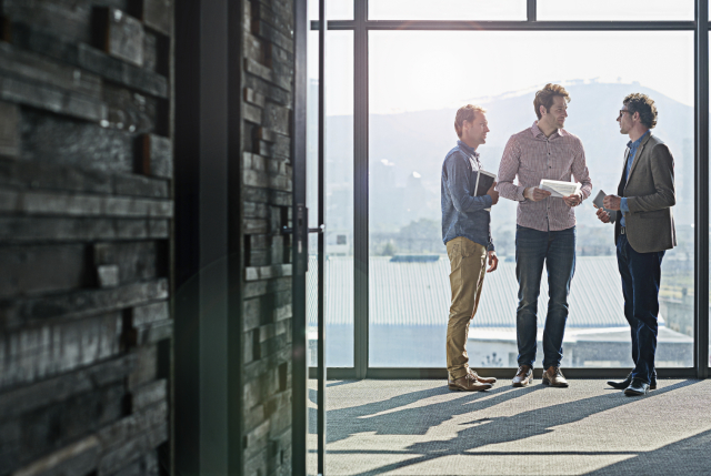 Photo of 3 people consulting