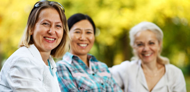 3 Women sitting on a bench